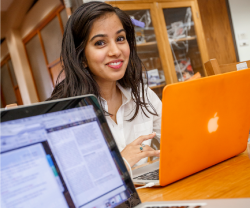 A student works on her computer.