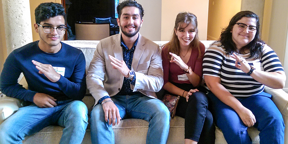 From left: Incoming freshmen Erik Jimenez, Hunter Hoevker, Raquel Schmidt and student Natalie Becerra Padilla flash the mini-Whoosh at the Houston event.