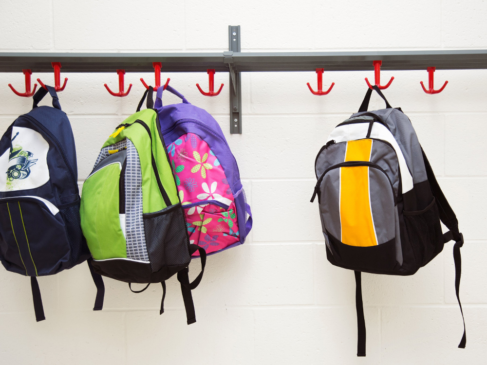 Backpacks hanging on hooks