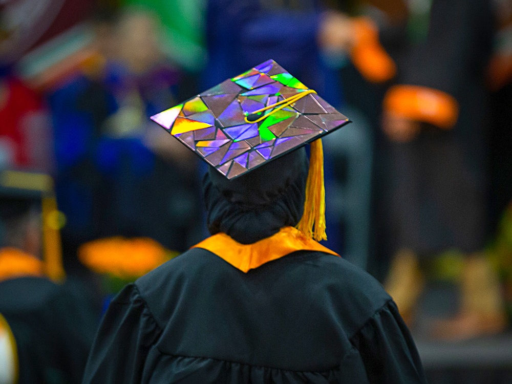 Graduation cap with reflective triangles