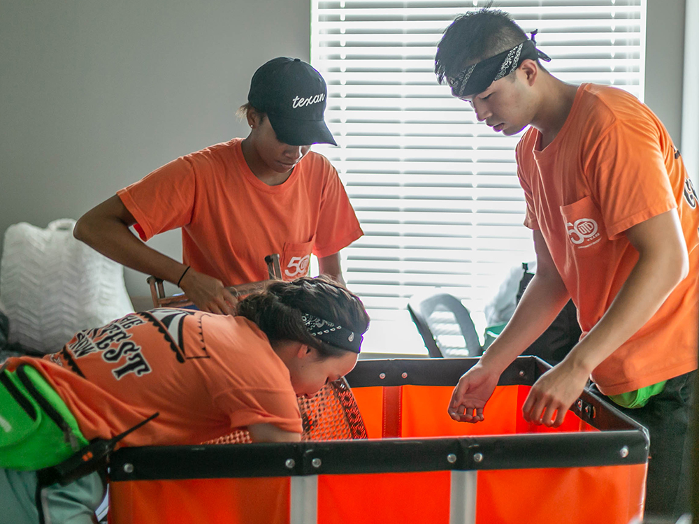 Students unloading cart