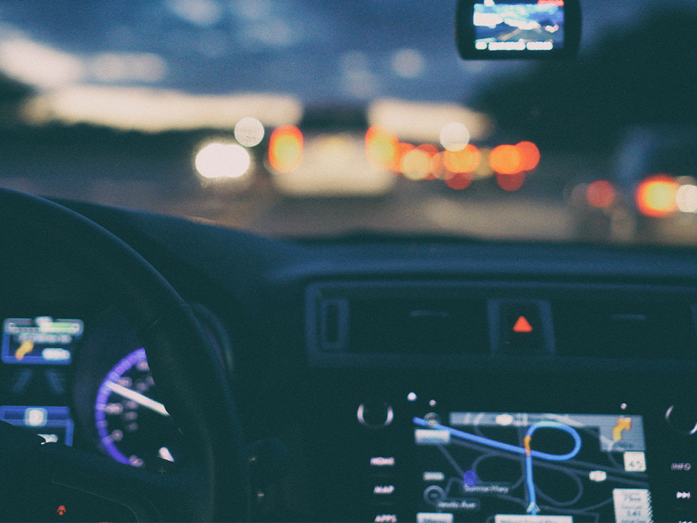 Inside of a car with gps at night